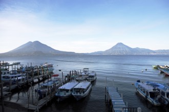 Boats on the pier, Lake Atitlán or Lake Atitlán in the morning, the volcanoes San Pedro, Atitlán