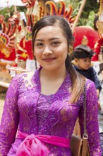 Young woman wearing solemn attire for the cremation ceremony, Ubu8d, Bali, Indonesia