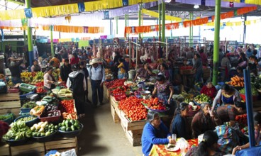 Mayan woman wearing traditional clothes at the market in Sololá, Highlands, Sololá Department,