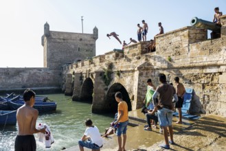Children playing on the promenade, Essaouira, UNESCO World Heritage Site, Atlantic coast, Morocco