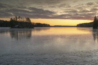 Ice formation on the shore of a lake, forest, sunrise, winter, Hartola, Finland
