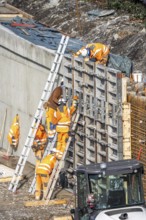 Construction work on a concrete retaining wall at the Duisburg-Kaiserberg motorway junction, on the