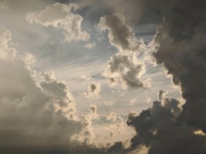 Solid clouds are penetrated by sunlight and create a dramatic spectacle, Germany
