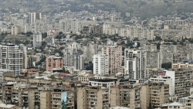 Panorama of a dense urban landscape with numerous high-rise buildings