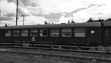 Side view of a historic railroad car on rails with visible windows, nostalgic, Franconian Forest