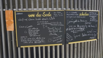 Blackboard written in chalk with various messages and notes during Corona, Berlin