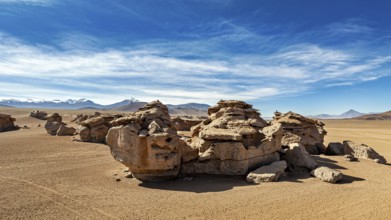 Impressive rock formations in a sandy desert landscape under clear skies, The landscape of the