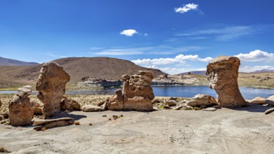 Clear water surrounded by rocks under a sunny, cloudless sky, The Altiplano landscape in Bolivia