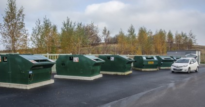Garbage station with garbage containers for various waste in Ystad, Skåne County, Sweden,