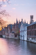 Bruges. Belgium. Flanders. Houses in the historic district overlooking a canal. UNESCO