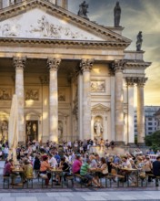 Listeners and spectators at a concert at Berlin's Gendarmenmarkt, Germany