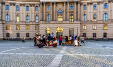 Tourist group with guides on Bebelplatz in Mitte, Berlin, Germany