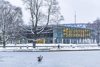Exterior view of the state parliament building with Eckensee and television tower. Winter in