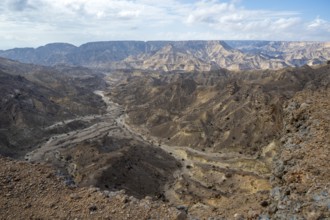 Barren mountains and gorges near Ash Shuwaymiyah, Oman