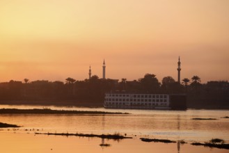 Nile cruise ship at sunset on the Nile, Luxor, Egypt