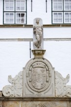Torhaus am palace gardens, façade with figure and coat of arms, Husum, North Frisia,