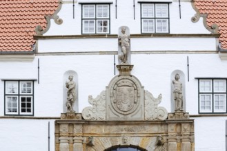 Torhaus am palace gardens, façade with figure and coat of arms, Husum, North Frisia,