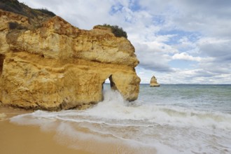 Rocky coast and beach in the surf, Praia do Camilo, Lagos, Algarve, Portugal
