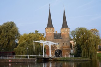 Oostpoort city gate and drawbridge on the Delftse Schie, Delft, South Holland, Netherlands