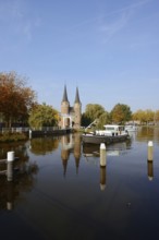 Oostpoort city gate and ship on the Delftse Schie, Delft, South Holland, Netherlands