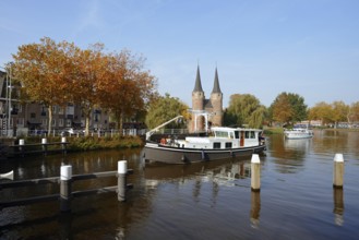 Oostpoort city gate and ship on the Delftse Schie, Delft, South Holland, Netherlands