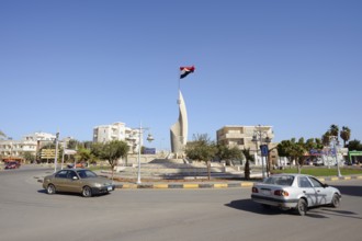 Roundabout with sculpture and Egyptian flag, Hurghada, Red Sea Governorates, Egypt