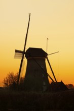 Historic windmill at sunset, UNESCO World Heritage Site, Kinderdijk, South Holland, Netherlands
