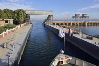 Nile cruise ship enters the lock at the Esna dam, Esna, Egypt