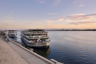 Nile cruise ships at sunrise at the pier in Esna, Egypt