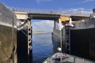 Nile cruise ship leaves the lock at the Esna dam, Esna, Egypt
