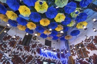 Umbrellas as decoration in a courtyard of a restaurant, Czernowicz, Ukraine