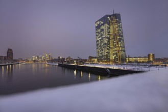 Snow lies along the banks of the Main from the European Central Bank (ECB) to the Frankfurt banking