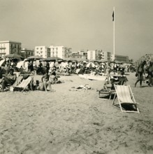 Historical photo summer 1961, tourists, beach, Rimini, Italy