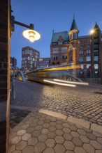 Road traffic in Speicherstadt at blue hour, Hamburg, Germany