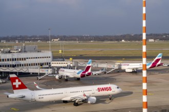 Düsseldorf airport, DUS, terminal A Eurowings aircraft at the gate, Swiss Airbus A321-200 aircraft