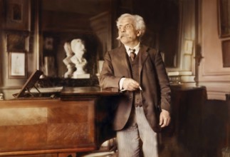 Gabriel Fauré, 1845 – 1924, French composer, next to his piano in his appartement, Boulevard