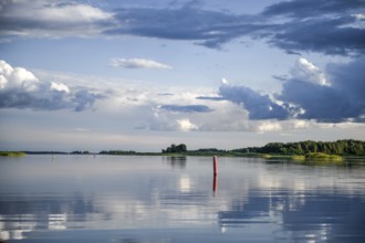 Fairway to Ekenäs harbour with sea mark on Lake Vänern, water reflecting the sky, Ekenäs,