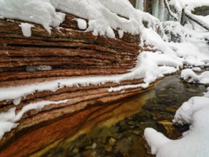 Taugl or Tauglbach flows through the snow-covered and icy red gorge, also Marmorklamm, Bad Vigaun,