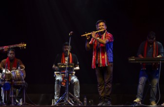 Flutist Dilip Hira performs during a cultural evening program at Shilpgram Mohotsav 2026 in