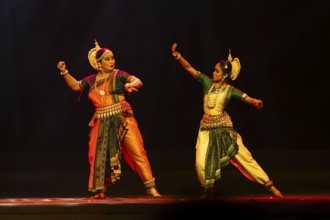 Artists perform Odissi classical dance during a cultural evening program at Shilpgram Mohotsav 2026