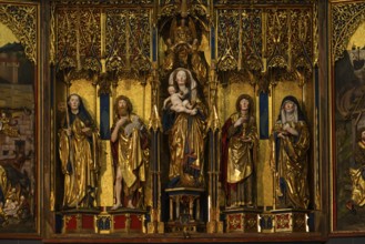 Mother of God on the crescent moon with baby Jesus, elevated on a pedestal, left and right John the