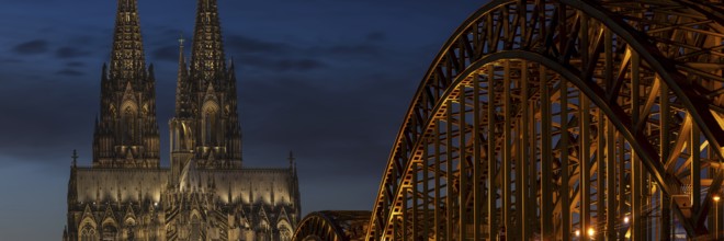 Evening atmosphere, Cologne Cathedral illuminated with LED lamps and the Hohenzollern Bridge,