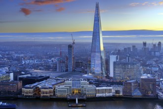 The Shard, pyramid-shaped skyscraper and London Bridge Station along the River Thames in Southwark