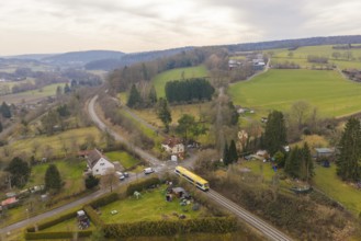 Aerial view of a hilly landscape with train, fields and small villages, acceptance of the Hermann