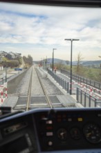 View from a train window of an empty railway line under the open sky, taking the Hermann Hesse