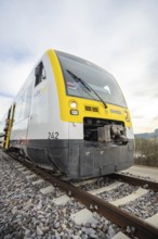Close-up of a modern SWEG train on the rails, taking off the Hermann Hesse Railway, Calw, Black