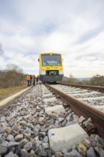 Close-up of a train on the rails with passengers nearby, acceptance of the Hermann Hesse Railway,
