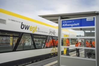 Passengers board a train at Althengstett station, taken by the Hermann Hesse Railway, Calw, Black