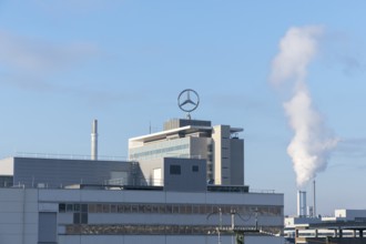 Modern building with Mercedes logo and rising steam under a clear sky, Mercedes Star,
