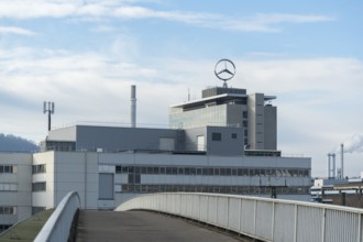 Building with Mercedes logo and front view of a bridge under cloudy sky, Mercedes Star,